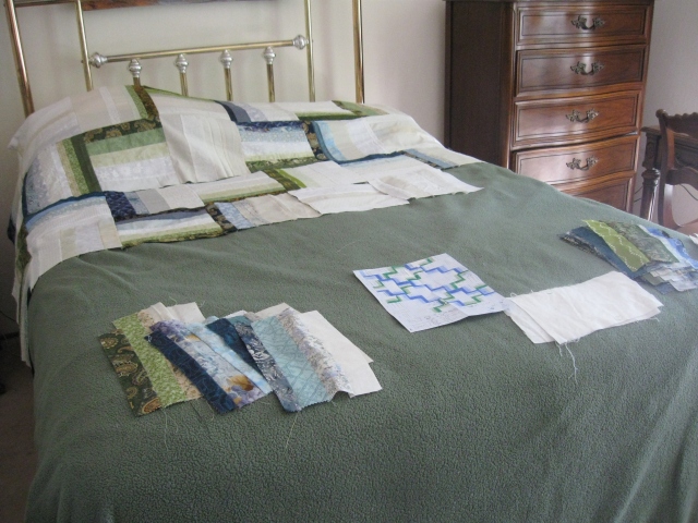 work in progress auction rail fence block quilt on bed